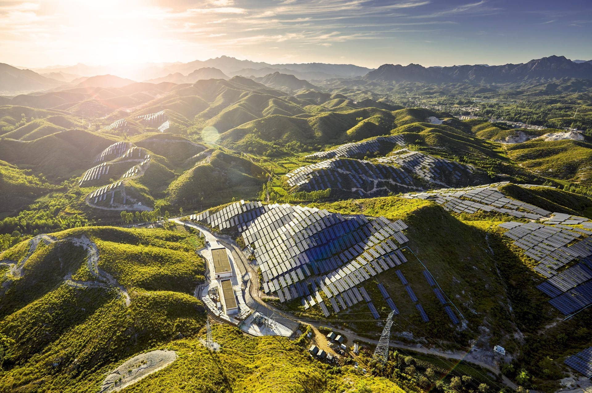 Renewable energy infrastructure across a mountainous landscape in Southeast Asia